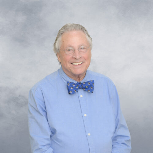 David Mooney wearing a blue shirt and bow tie