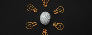 graphic of a brain surrounded by lightbulbs