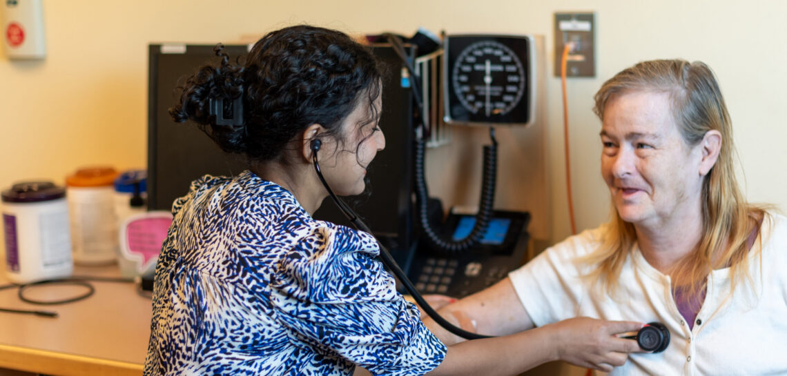 A patient receive medical care from a clinician at Community Health Centers. Photo by Renee Greenlee
