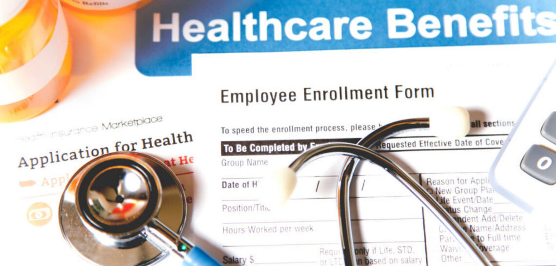 2026-open-enrollment illustrative photo for open enrollment, featuring a stethoscope, form, and pill bottle.